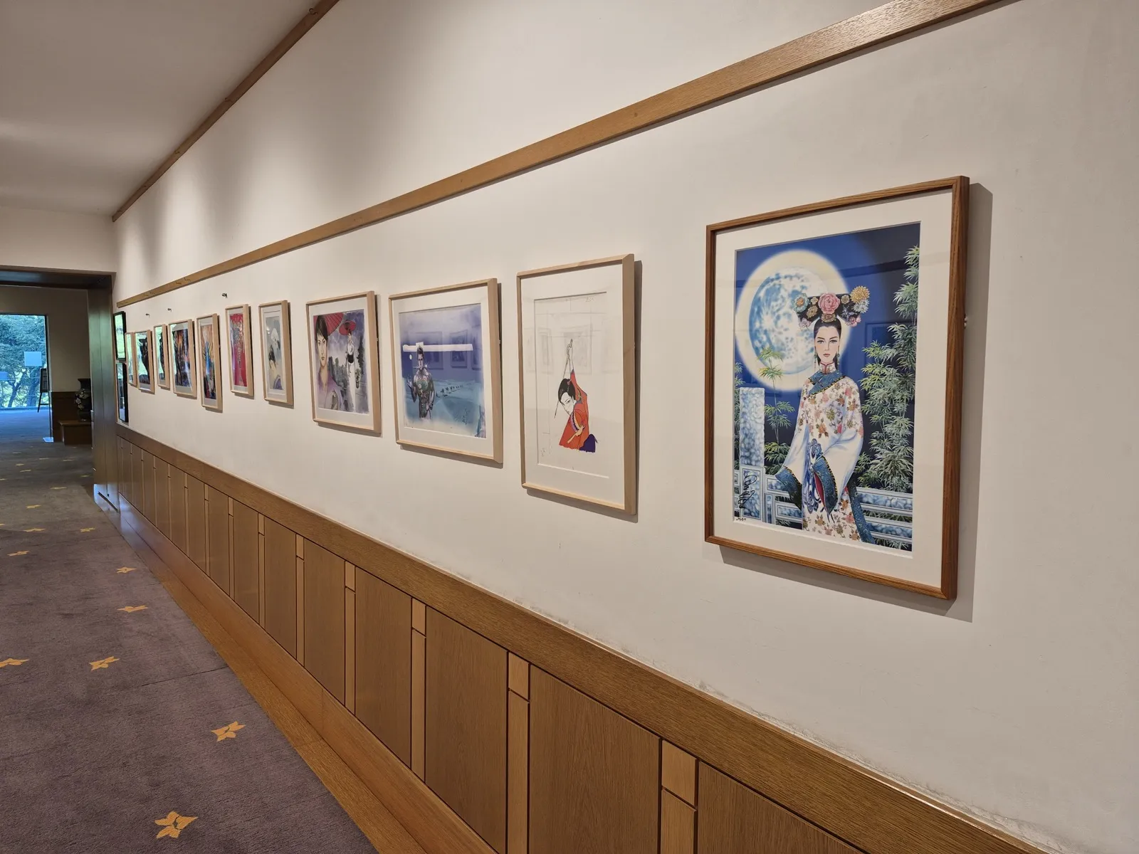 A gallery corridor lined with framed manga artwork